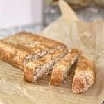 Homemade high fiber classic chia grain-free bread on parchment paper sliced