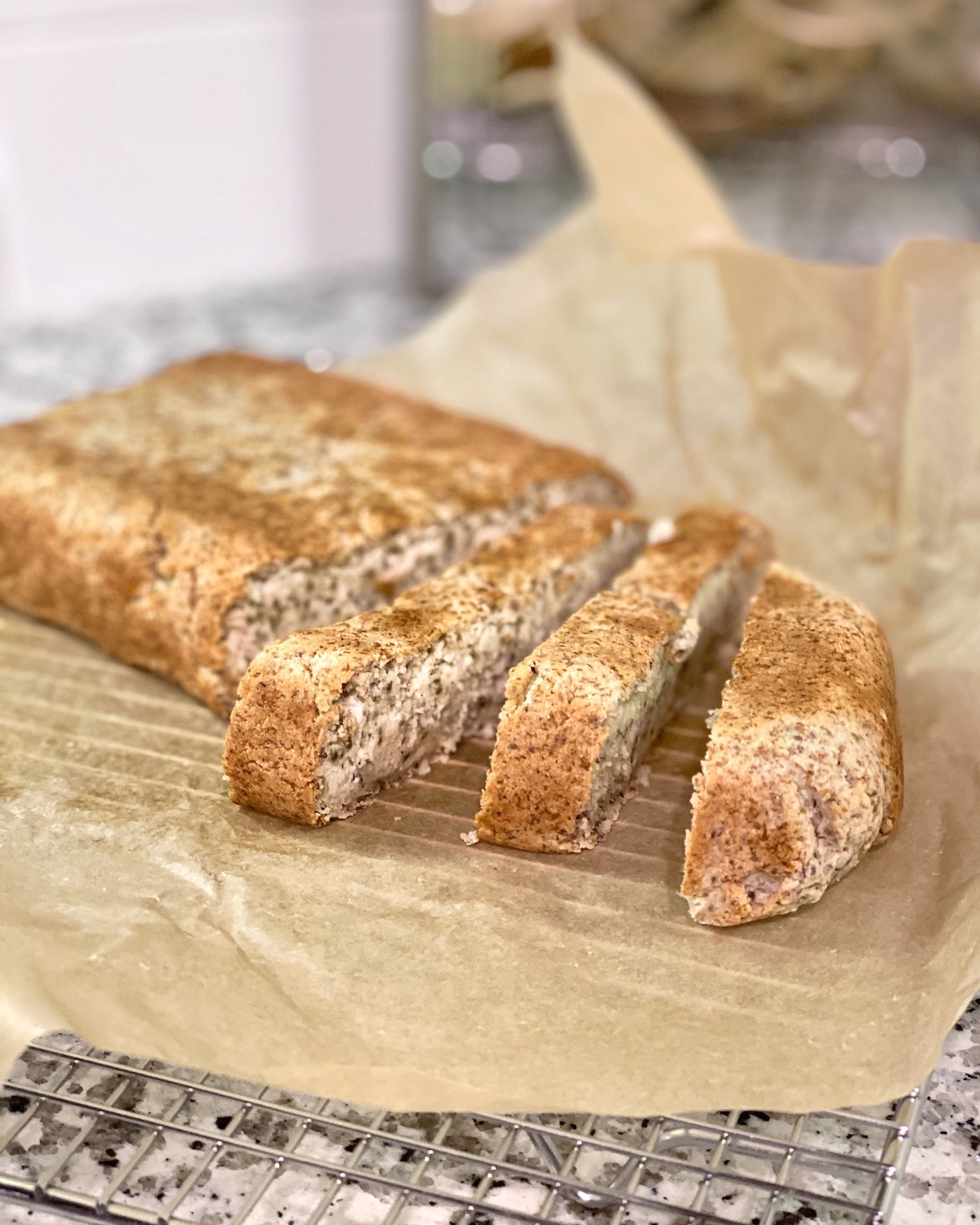 Homemade high fiber classic chia grain-free bread on parchment paper sliced