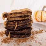 Side view of stack of chocolate pumpkins with sunbutter drizzle